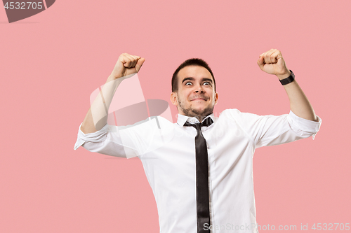 Image of Winning success man happy ecstatic celebrating being a winner. Dynamic energetic image of male model