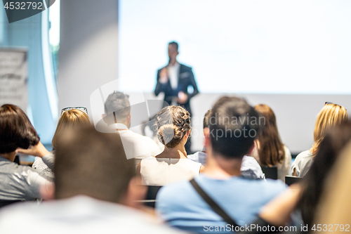 Image of Male business speaker giving a talk at business conference event.