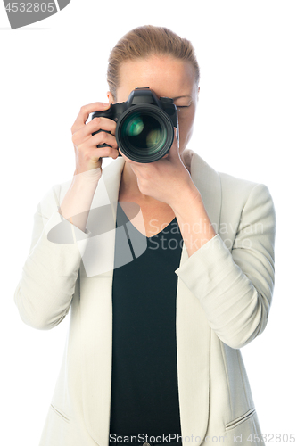 Image of Beautiful young photographer with camera in professional studio