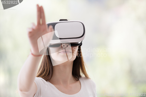 Image of woman using VR-headset glasses of virtual reality