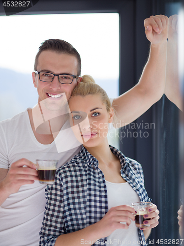 Image of young couple enjoying morning coffee