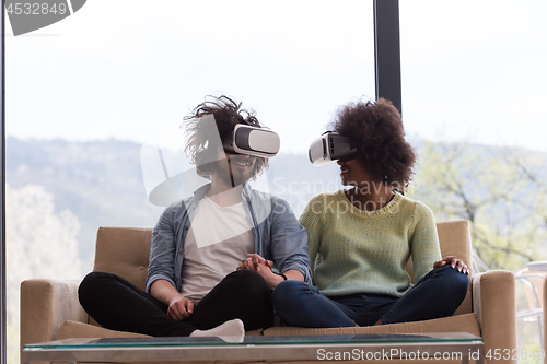 Image of Multiethnic Couple using virtual reality headset