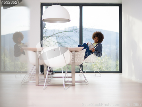 Image of young African American woman in the living room
