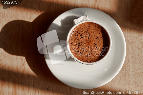 Image of a cup of turkish coffee with foam