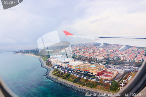 Image of view from the airplane window to the city