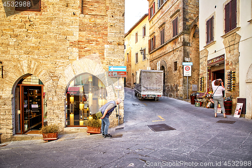 Image of Tourists in historic center of city Montepulciano, Italy