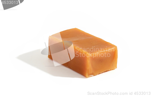 Image of caramel candy on white background