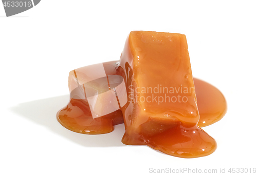 Image of caramel candies on white background