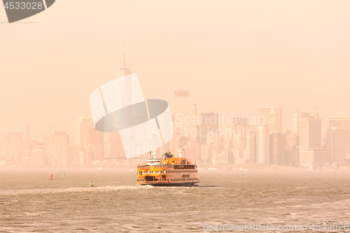 Image of Staten Island Ferry and Lower Manhattan Skyline, New York, USA.