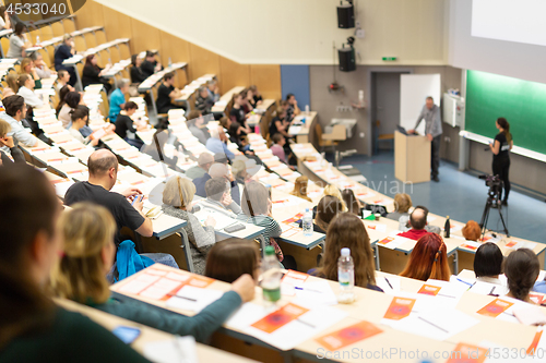 Image of Expert speaker giving a talk at scientific business conference event.