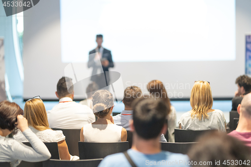 Image of Male business speaker giving a talk at business conference event.