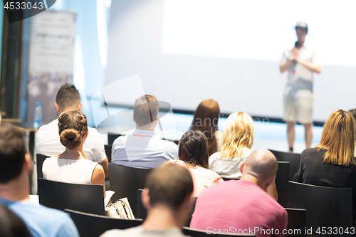 Image of Male business speaker giving a talk at business conference event.