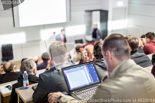 Image of Business speaker giving a talk at business conference event.