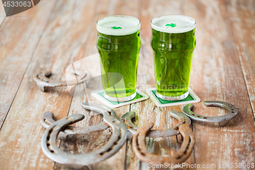 Image of glasses of green beer with shamrock