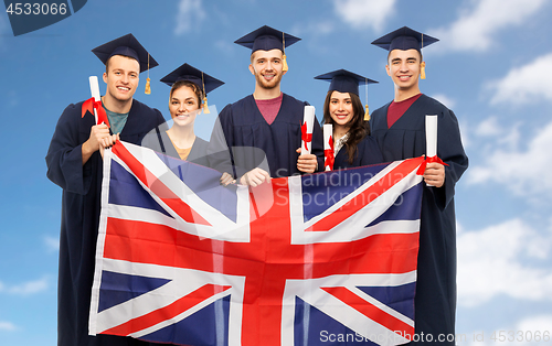 Image of graduate students with diplomas and british flag