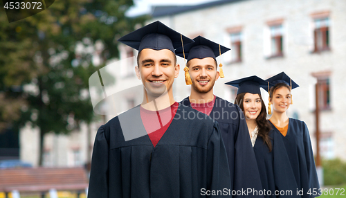 Image of graduates in mortar boards and bachelor gowns