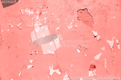 Image of painted stone wall texture in living coral color