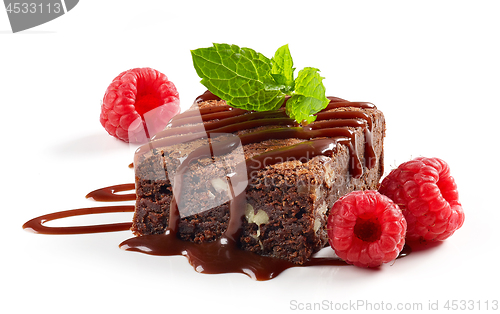 Image of piece of chocolate cake brownie with raspberries