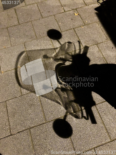 Image of motorcycle shadow at night