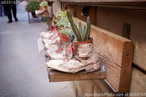 Image of shoe store advertising on street of Montepulciano 