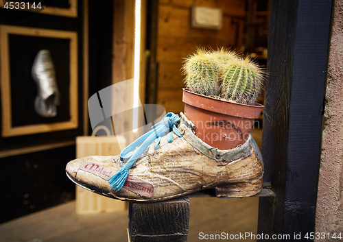 Image of shoe store advertising on street of Montepulciano 