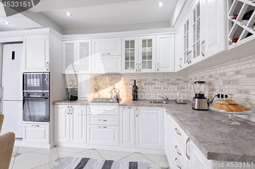 Image of modern white wooden kitchen interior