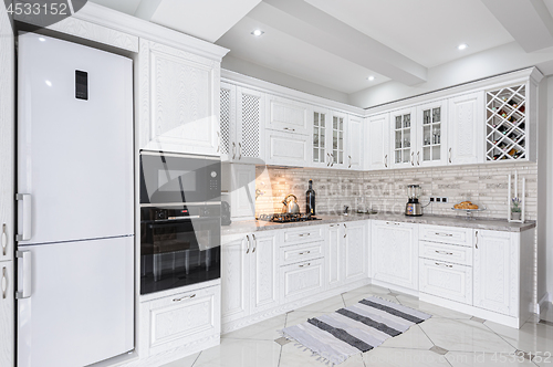 Image of modern white wooden kitchen interior