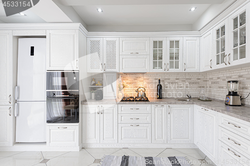 Image of modern white wooden kitchen interior