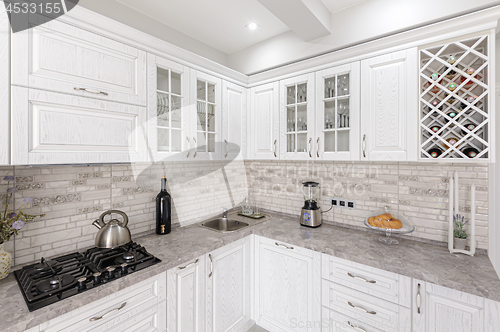 Image of modern white wooden kitchen interior