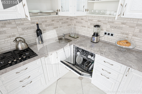 Image of modern white wooden kitchen interior