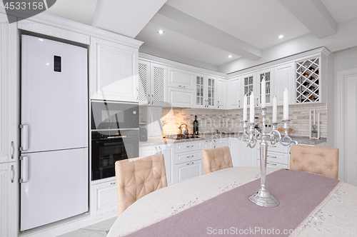 Image of modern white wooden kitchen interior