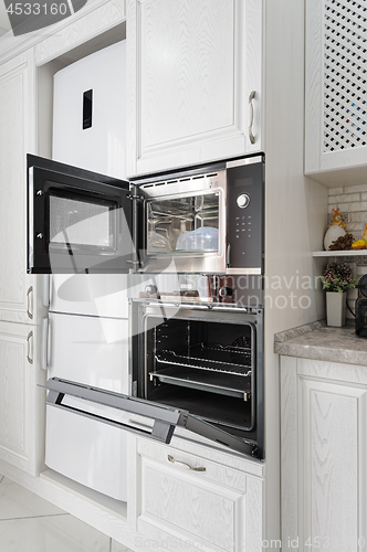 Image of modern white wooden kitchen interior