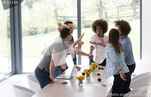 Image of multiethnic startup Group of young business people celebrating s