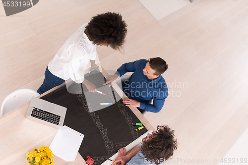 Image of top view of Multiethnic startup business team on meeting