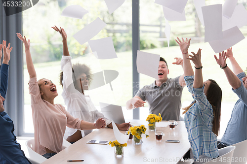 Image of multiethnic startup Group of young business people throwing docu