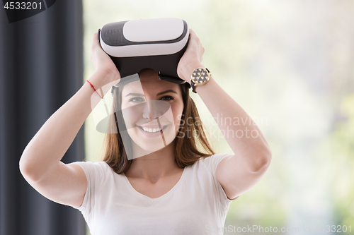 Image of woman using VR-headset glasses of virtual reality