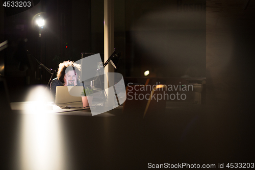 Image of businessman relaxing at the desk