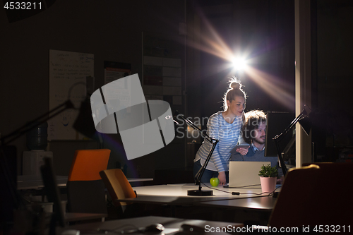 Image of young designers in the night office