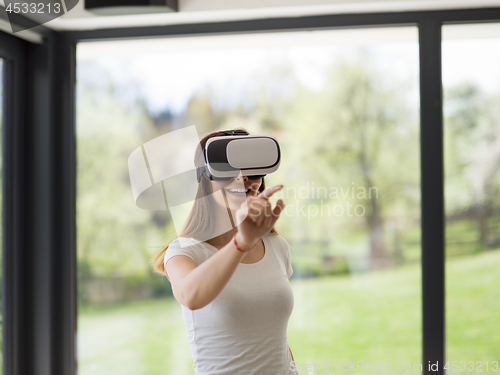 Image of woman using VR-headset glasses of virtual reality