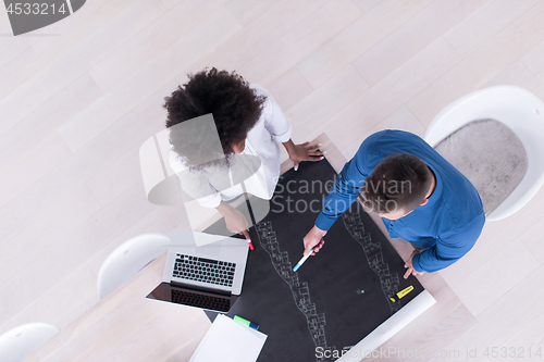 Image of top view of Multiethnic startup business team on meeting