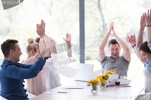 Image of multiethnic startup Group of young business people throwing docu