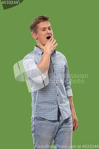 Image of Beautiful bored man bored isolated on green background