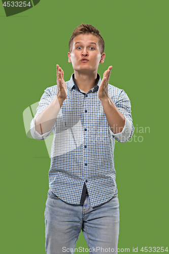 Image of Portrait of attractive man with kiss isolated over green background