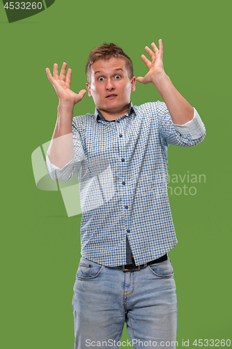 Image of Portrait of the scared man on green