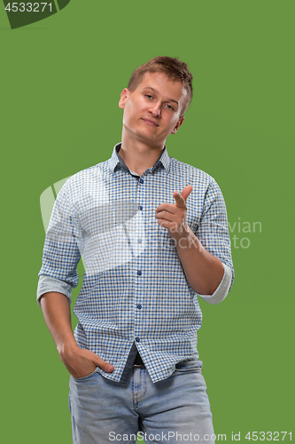 Image of The overbearing businessman point you and want you, half length closeup portrait on green background.