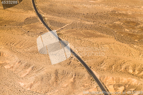 Image of aerial view of road in grand canyon desert