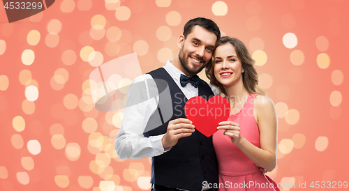 Image of happy couple with red heart on valentines day