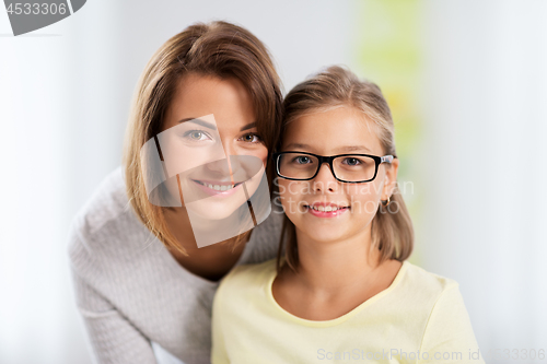 Image of portrait of happy mother and daughter