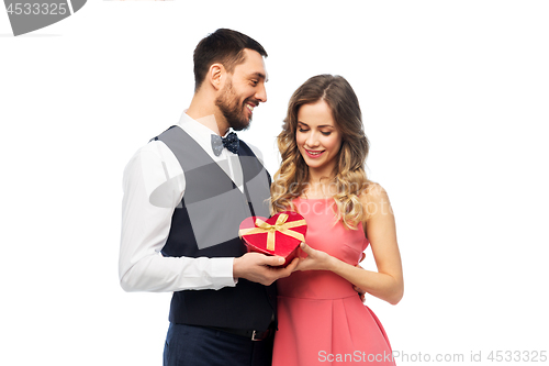 Image of happy couple with gift on valentines day