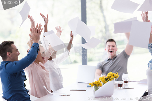 Image of multiethnic startup Group of young business people throwing docu